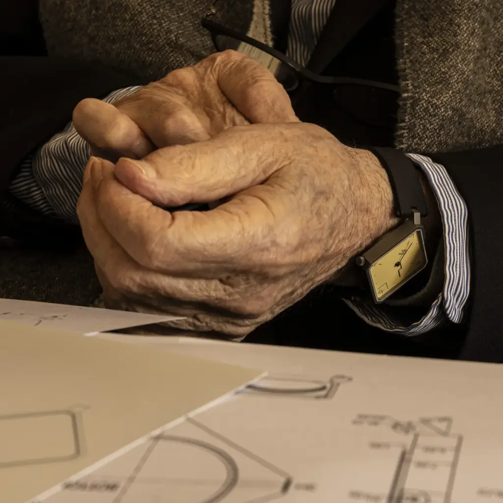 Álvaro Siza wearing the LEBOND Siza watch beside his design sketches